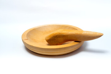 Traditional wooden mortar and pestle isolated on white background, used for grinding spices, herbs, and food ingredients, symbolizing culture and cooking.