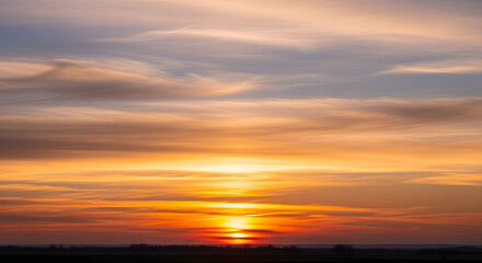 Obraz premium Golden Hour Serenity Beautiful Sunset Sky with Vibrant Hues Over the Horizon Landscape