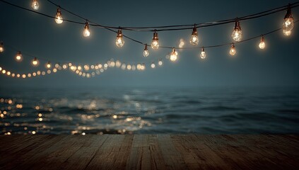 String lights over a wooden dock overlooking a dark ocean at night