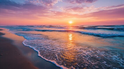 Serene beach scene at sunset with colorful sky, gentle waves, and sandy shoreline