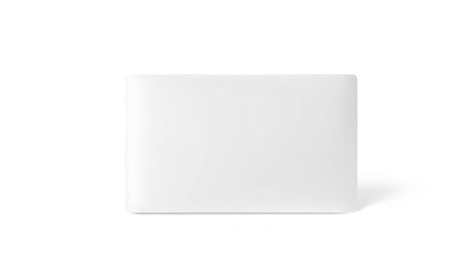 An offwhite squarish object on a white surface casting a light shadow The shape has slightly rounded corners
