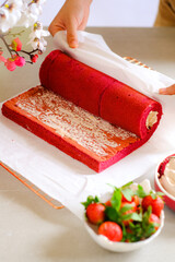 still life roll cake in red and white concept