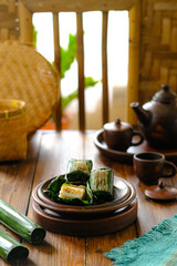 lemper is an Indonesian savoury snack made of glutinous rice filled seasoned shredded chicken, or shrimp and serundeng