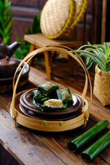 lemper is an Indonesian savoury snack made of glutinous rice filled seasoned shredded chicken, or shrimp and serundeng
