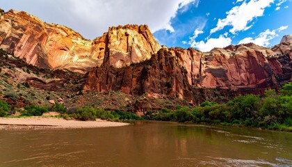 Scenic landscape of a river flowing through a canyon with rocky cliffs.