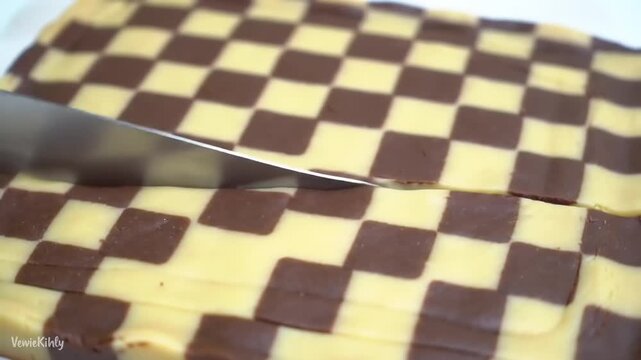 Checkered cookies being cut