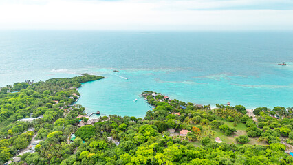 Stunning aerial view of Rosario Island near Cartagena, featuring lush greenery and vibrant turquoise waters.
