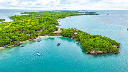 Stunning aerial view of Rosario Island showcasing lush greenery and tranquil waters, a perfect tropical getaway in Cartagena, Colombia.
