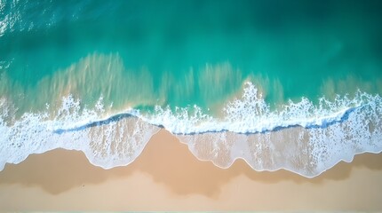 Fototapeta premium Stunning aerial view of pristine turquoise ocean waves gently crashing onto a golden sandy beach