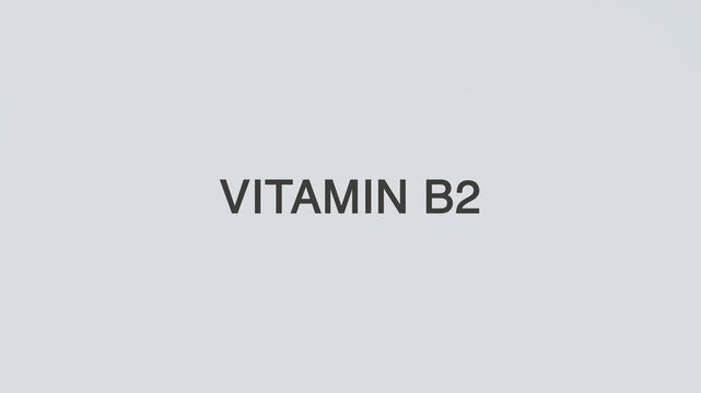 Vitamin B2 concept word hand holding stethoscope on white background for nutrition monitoring, deficiency prevention, treatment, wellness, and overall health awareness