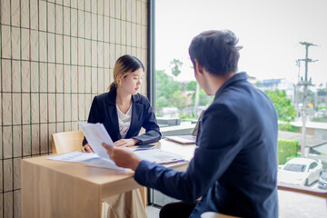 Business colleagues in office discussion using digital tablet, focusing on teamwork, leadership, strategy, partnership, motivation, and professional collaboration.
