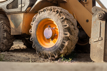 Closeup of excavator dirty tire wheel