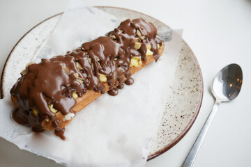 Delicious dessert with chocolate topping and nuts served