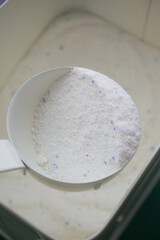 Measuring white powder in a kitchen container