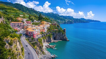Scenic Coastal View of Colorful Houses Along Rugged Cliffside Next to Bright Blue Ocean Water Under Clear Sky