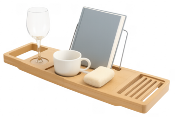 Wooden bathtub caddy holding wine glass, book, soap and coffee mug on transparent background