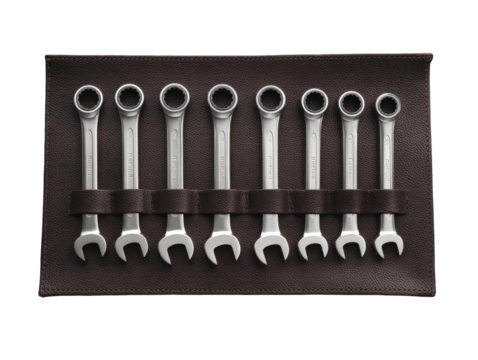 Metal wrenches in a brown leather tool roll