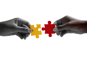 Two hands connecting red and yellow puzzle pieces against black isolated on a transparent background