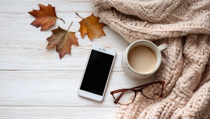 Cozy autumn scene phone, coffee, glasses, sweater, leaves (1)