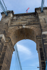 Fototapeta premium One of the arches on the Roebling Suspension Bridge. Tower in need of repair due to sandstone particles falling down.