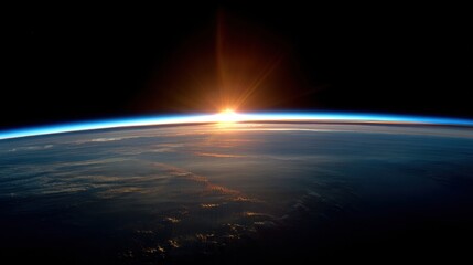 Earth's Horizon: A stunning visual of Earth's atmosphere and horizon, bathed in the radiant glow of sunrise, offering a breathtaking view of the cosmos and the awe-inspiring vastness of space.