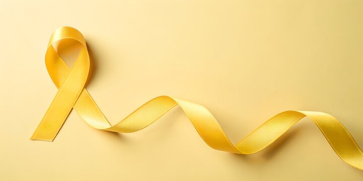 Yellow awareness ribbon on pastel background symbolizing hope, support, and solidarity for health and social causes