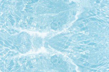 Blue water with ripples on the surface. Defocus blurred transparent blue colored clear calm water surface texture with splashes and bubbles. Water waves with shining pattern texture background.