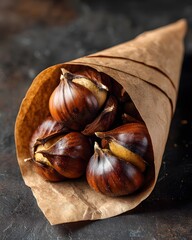 A rustic cone filled with roasted chestnuts resting on a dark surface, evoking autumn warmth and comfort