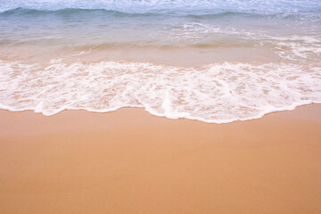 Beach sand background for summer vacation concept. Beach nature and summer seawater with sunlight light sandy beach Sparkling sea water	
