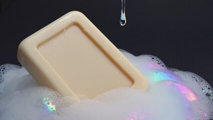 Bar of soap with foam, slow water drip falling beside background. Ai generated.