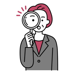 虫眼鏡を覗く中年のスーツの女性