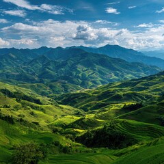 Lush green terraced mountains under a vibrant sky