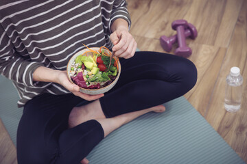Fototapeta na wymiar Fresh, nutritious salad held in a person's hands. A balanced meal for a healthy and mindful lifestyle.