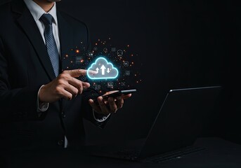 Businessman cloud computing upload with mobile phone, laptop in background