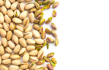 roasted pistachio nuts on a white background and place for inscription