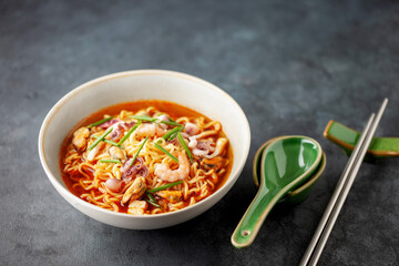 Jjamppong. Korean Seafood Noodle Soup in Bowl. Asian cuisine.
