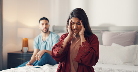 Argument, headache and stress with woman on bed in home for fighting or marriage conflict. Anxiety, divorce and migraine with couple in bedroom of apartment for disagreement, frustration or pain