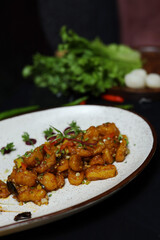 Crispy Water Chestnuts on white plate with lettuce on side