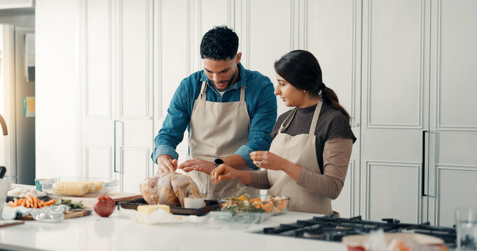 Cooking, chicken and couple in kitchen in home for bonding, connection or preparing meal together. Love, ingredients and man with woman for healthy, wellness or diet dinner for nutrition in apartment