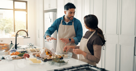 Cooking, talk and couple in kitchen in home for bonding, connection or preparing meal together. Chicken, ingredients and man with woman for healthy, wellness or diet dinner for nutrition in apartment