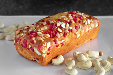 Cake garnished with cashew and tooti frooti and other dry fruits