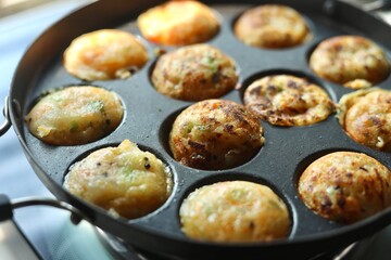 Appam or Mixed dal or Rava Appe South Indian dish preparation on iron pan