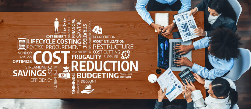 This image captures a collaborative business meeting focused on cost reduction and budgeting strategies, showcasing teamwork and modern financial analysis practices. Amity