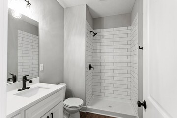 Bright living room interior in modern apartment with large windows
Clean white kitchen with stainless appliances in contemporary condo