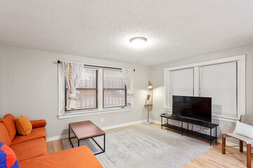 Bright living room interior in modern apartment with large windows
Clean white kitchen with stainless appliances in contemporary condo