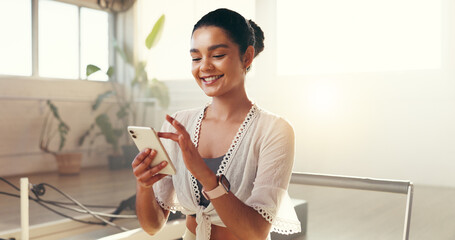 Woman, smartphone and scroll at pilates studio with smile for exercise update, social media and...
