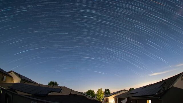 Star Trails TimeLapse Over Suburban Homes with Solar Panels at Night