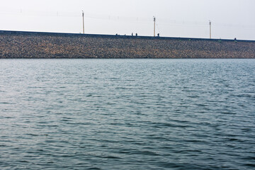 Scenic View of a Reservoir with Calm Waters and a Sturdy Dam