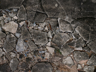 Cracked Concrete Floor with Chunky Fractures Texture Background.