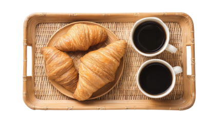 Croissants and coffee on a woven tray